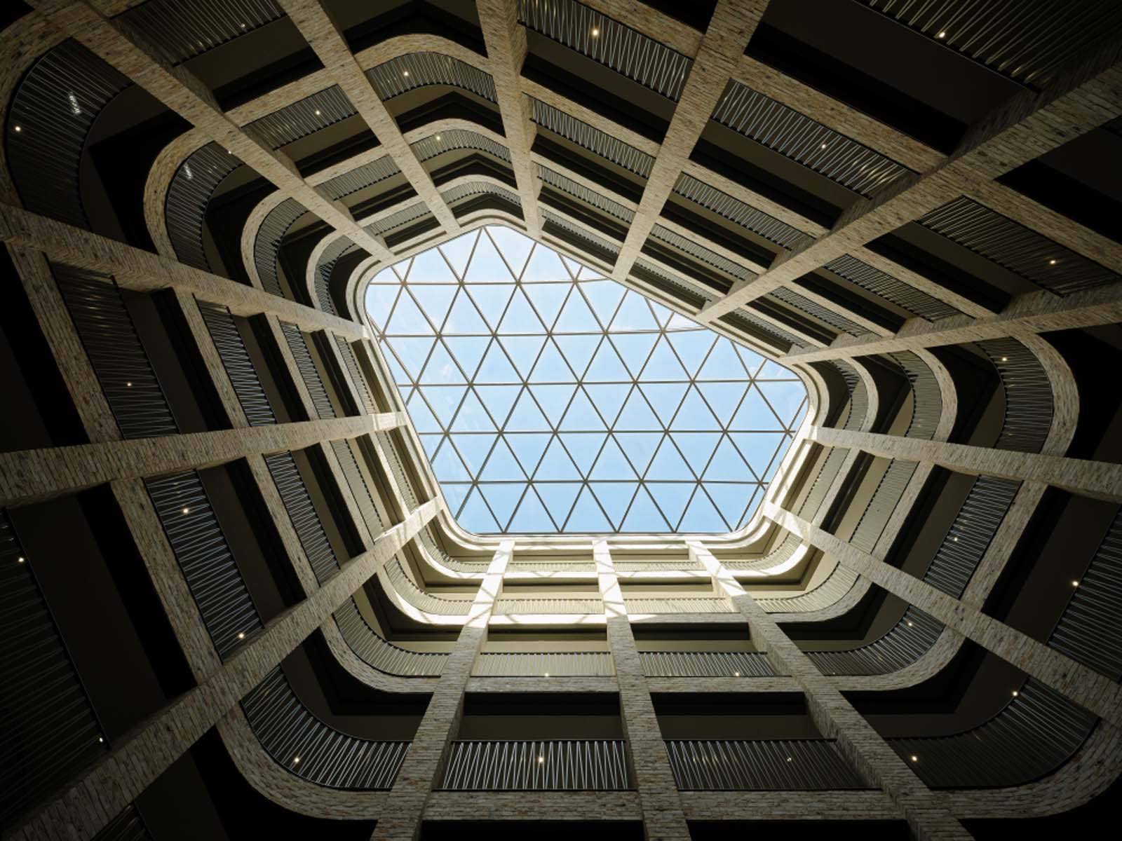 Modern building atrium with glass skylight.