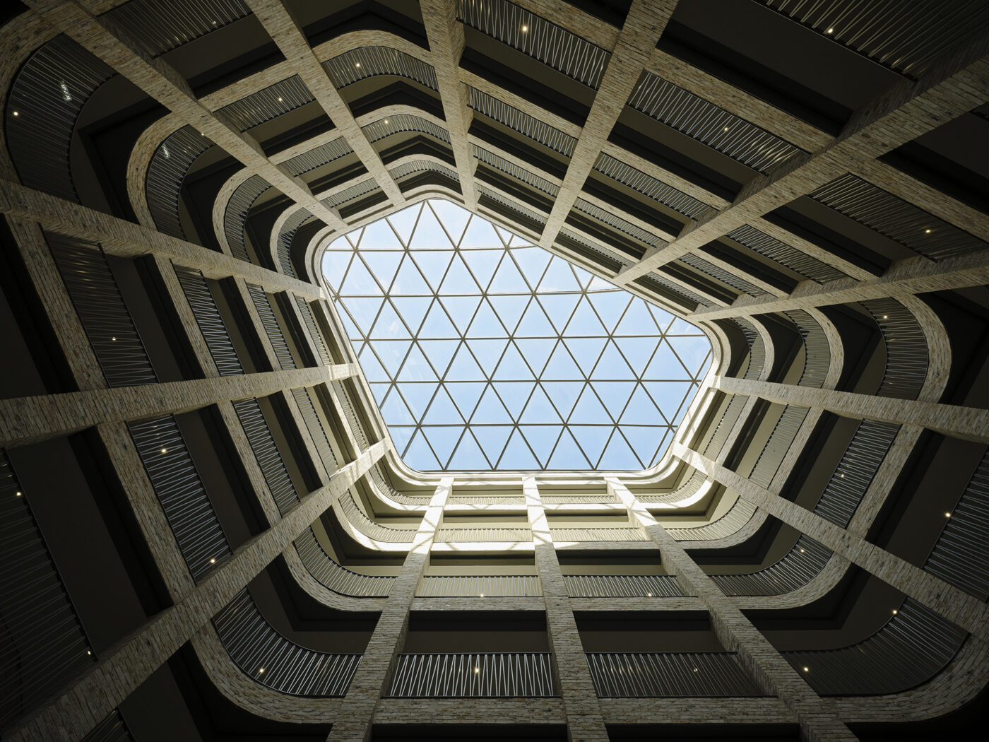 Modern building atrium with glass skylight.