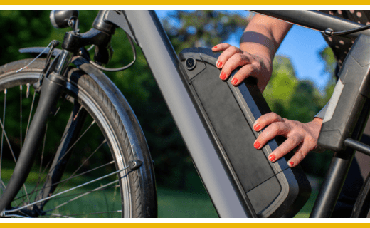 Person removing ebike battery.