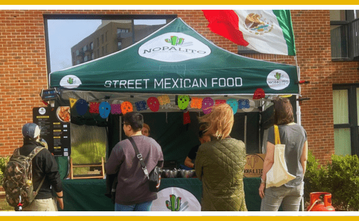People at a Nopalito street Mexican food stall.