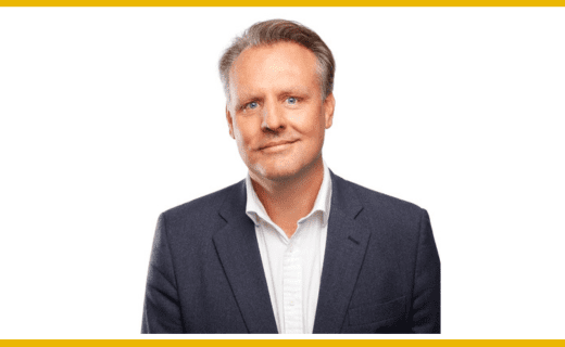 Headshot of a man in a suit.