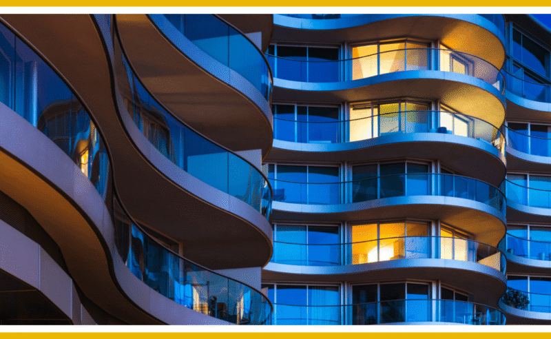 Modern apartment building at night.
