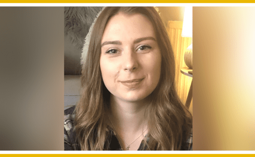 Portrait of a young woman with long brown hair.