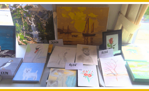Table of artwork created by retirement community residents.