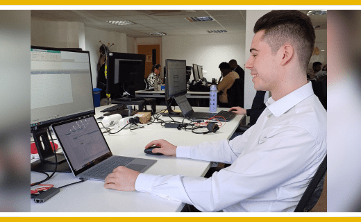 Ryan Smith, service charge accountant, working at a computer.