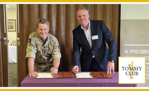 Tommy Club logo; two men signing documents.