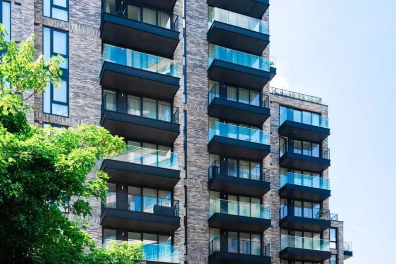 Exterior of modern apartment building with balconies.